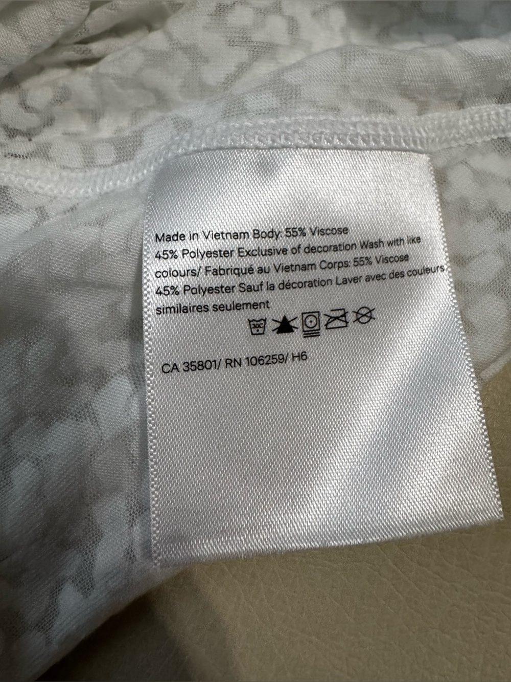 WHITE LULULEMON SEE
THROUGH SHORT SLEEVE TOP - Picture 6 of 8